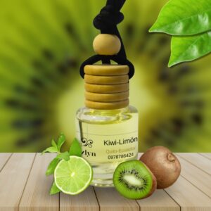 Difusor colgante para auto con Aroma a Kiwi-Limón Jazlyn Perfumería , sobre fondo vibrante con kiwis y limones, ideal para una fragancia frutal, cítrica y energizante en el auto