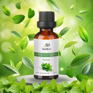 Mezcla de Aceite Esencial de Menta Jazlyn Perfumería en frasco de 10 ml , sobre pedestal blanco con hojas verdes cayendo y fondo claro, ideal para humidificador, bienestar respiratorio y concentración