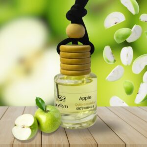 Difusor colgante para auto con aroma a Manzana Jazlyn Perfumería , sobre fondo vibrante con manzanas frescas, ideal para una fragancia frutal y energizante en el coche