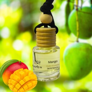 Difusor colgante para auto con aroma a Mango Jazlyn Perfumería , sobre fondo vibrante con mangos frescos, ideal para una fragancia tropical, dulce y energizante en el auto